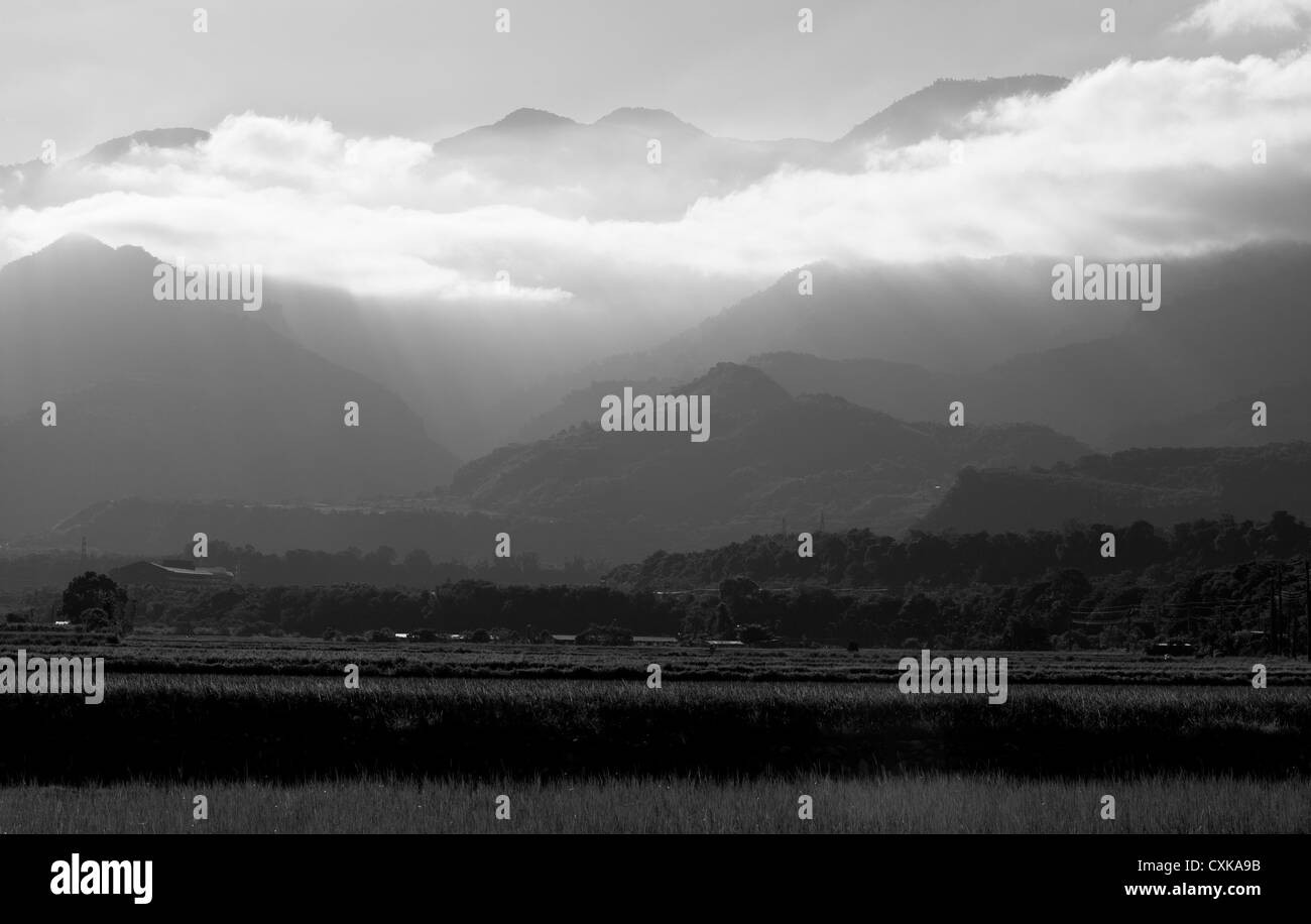 Sunlight rays clouds landscape Black and White Stock Photos & Images ...