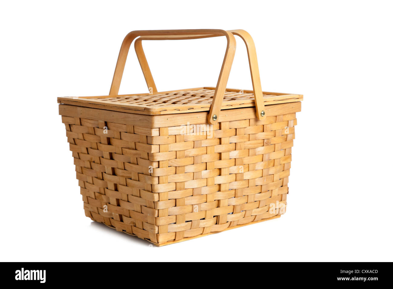 A wicker picnic basket on a white background Stock Photo - Alamy