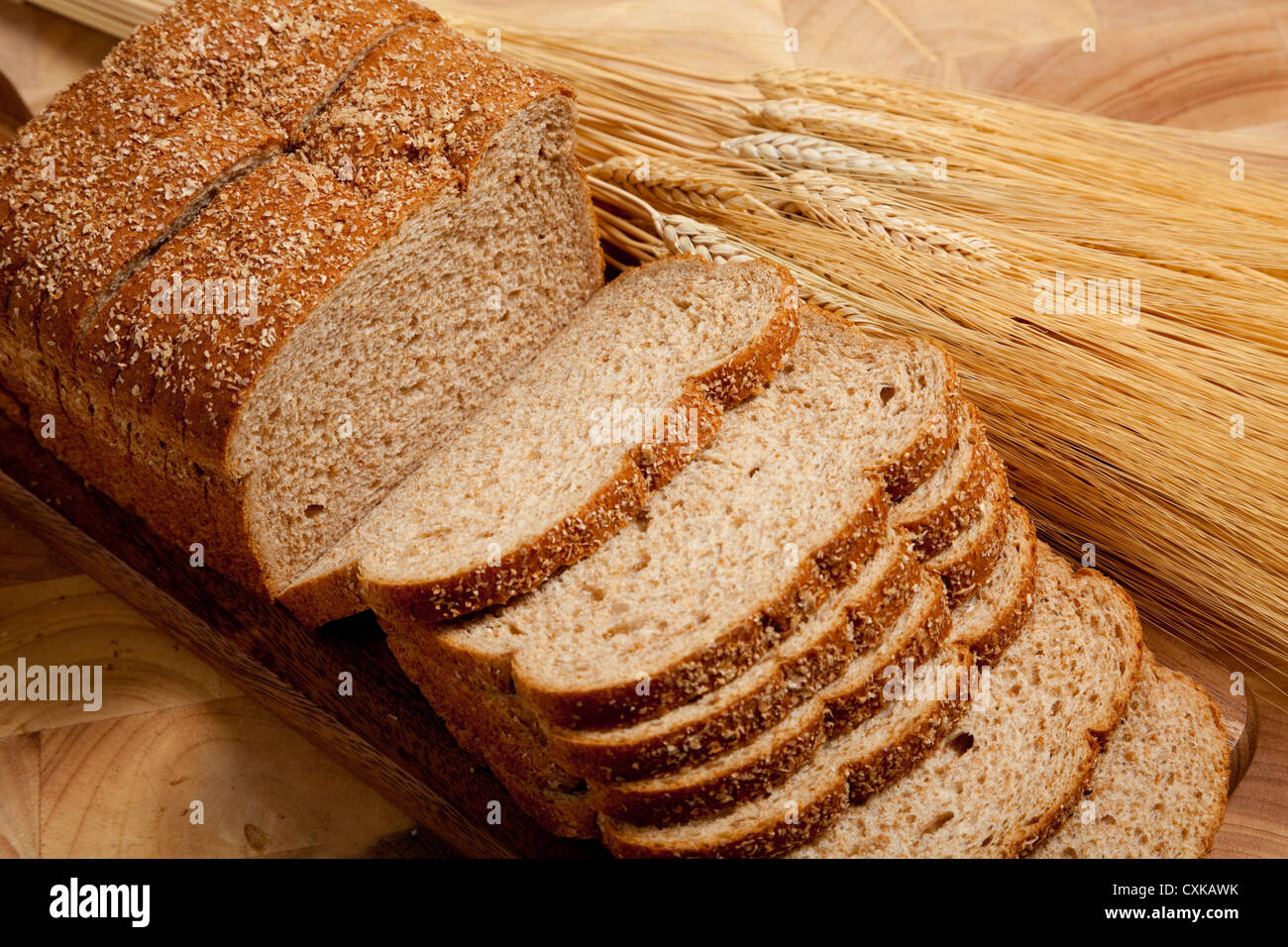 Loaf of wheat bread and shocks of wheat Stock Photo
