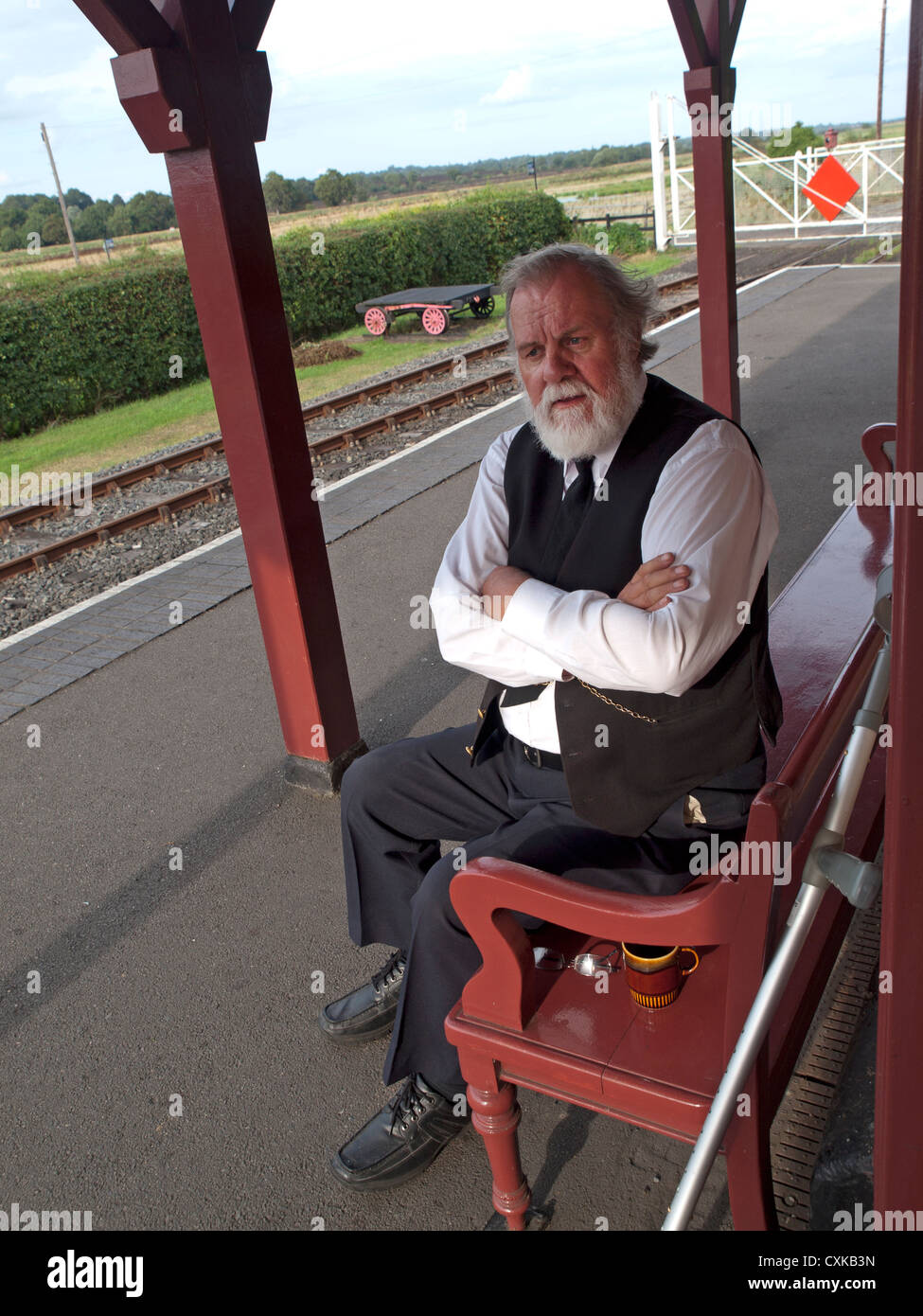 A train guard at Bodiam railway station Stock Photo Alamy