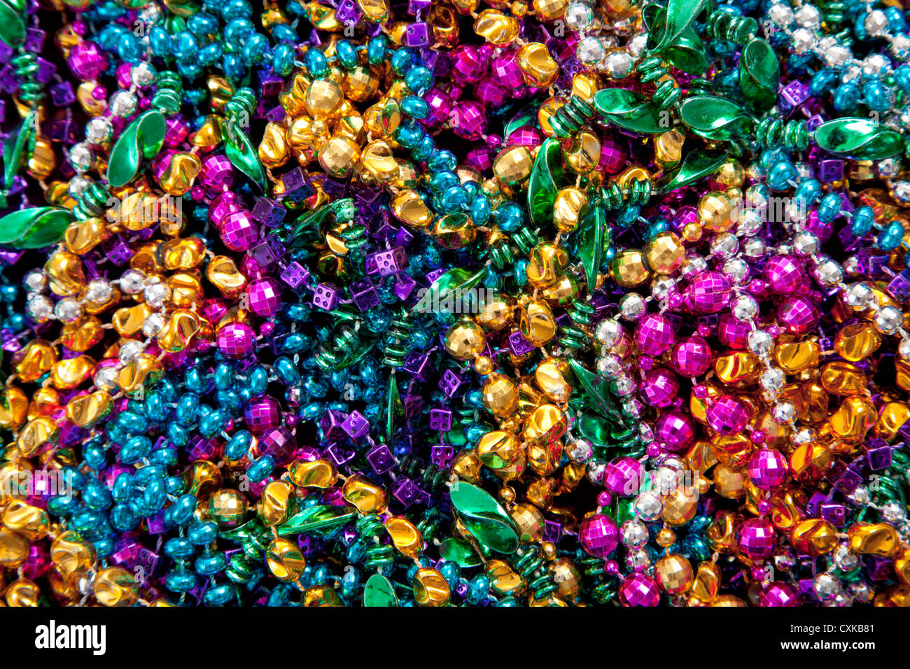 Colorful Mardi gras beads background. Green, purple and gold Merdi gras  beads Stock Photo - Alamy