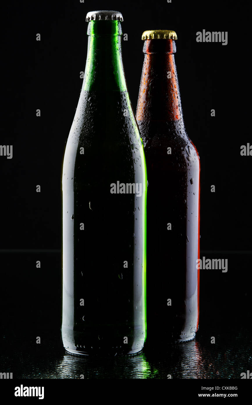 Two beer bottles silhouette, studio photo Stock Photo