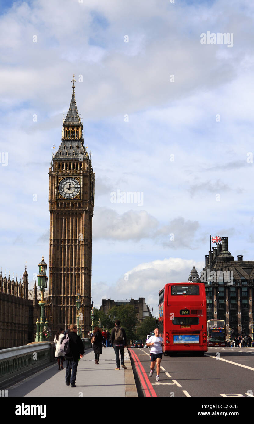 The rear of a London red double decker bus as it crosses Westminster Bridge, with Big Ben in the distance Stock Photo