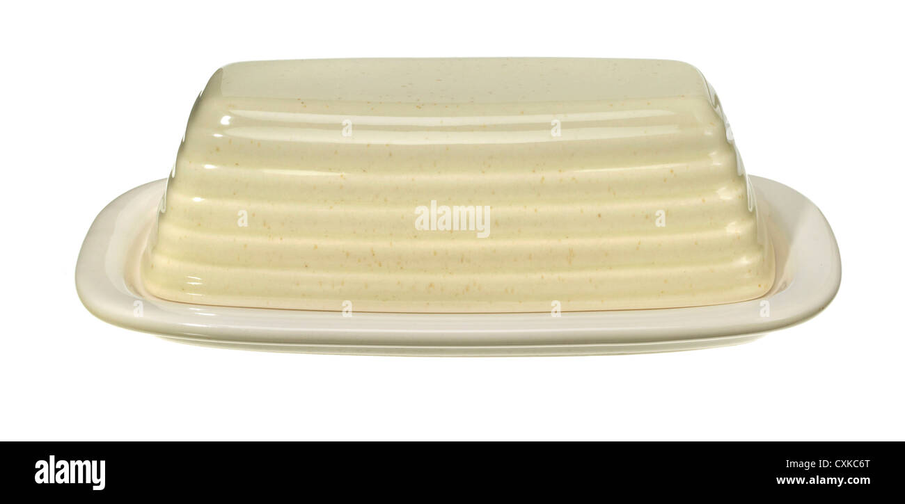 pale yellow porcelain butter dish photographed on a white background Stock Photo