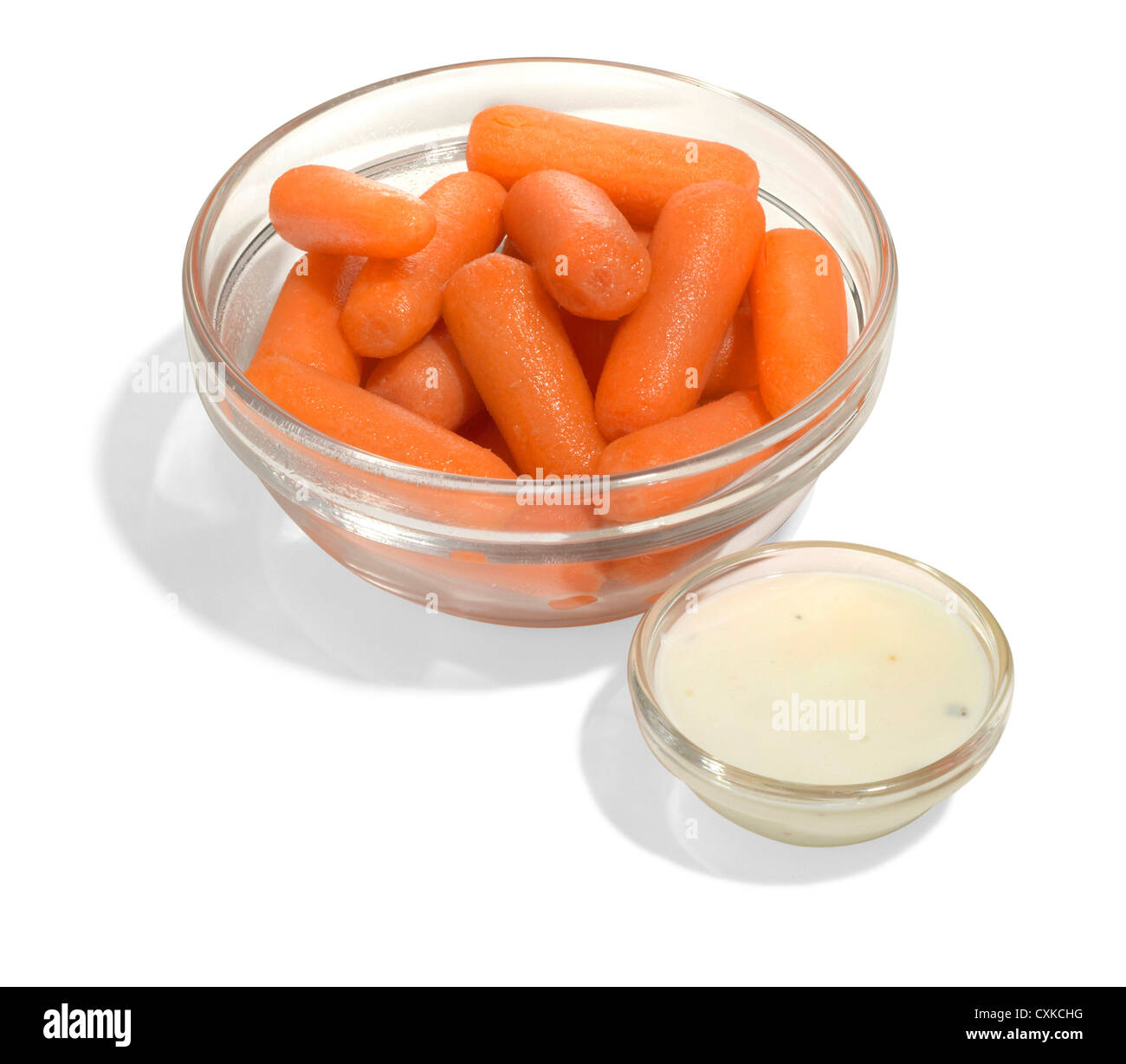 baby carrots and ranch dressing on a white background Stock Photo Alamy
