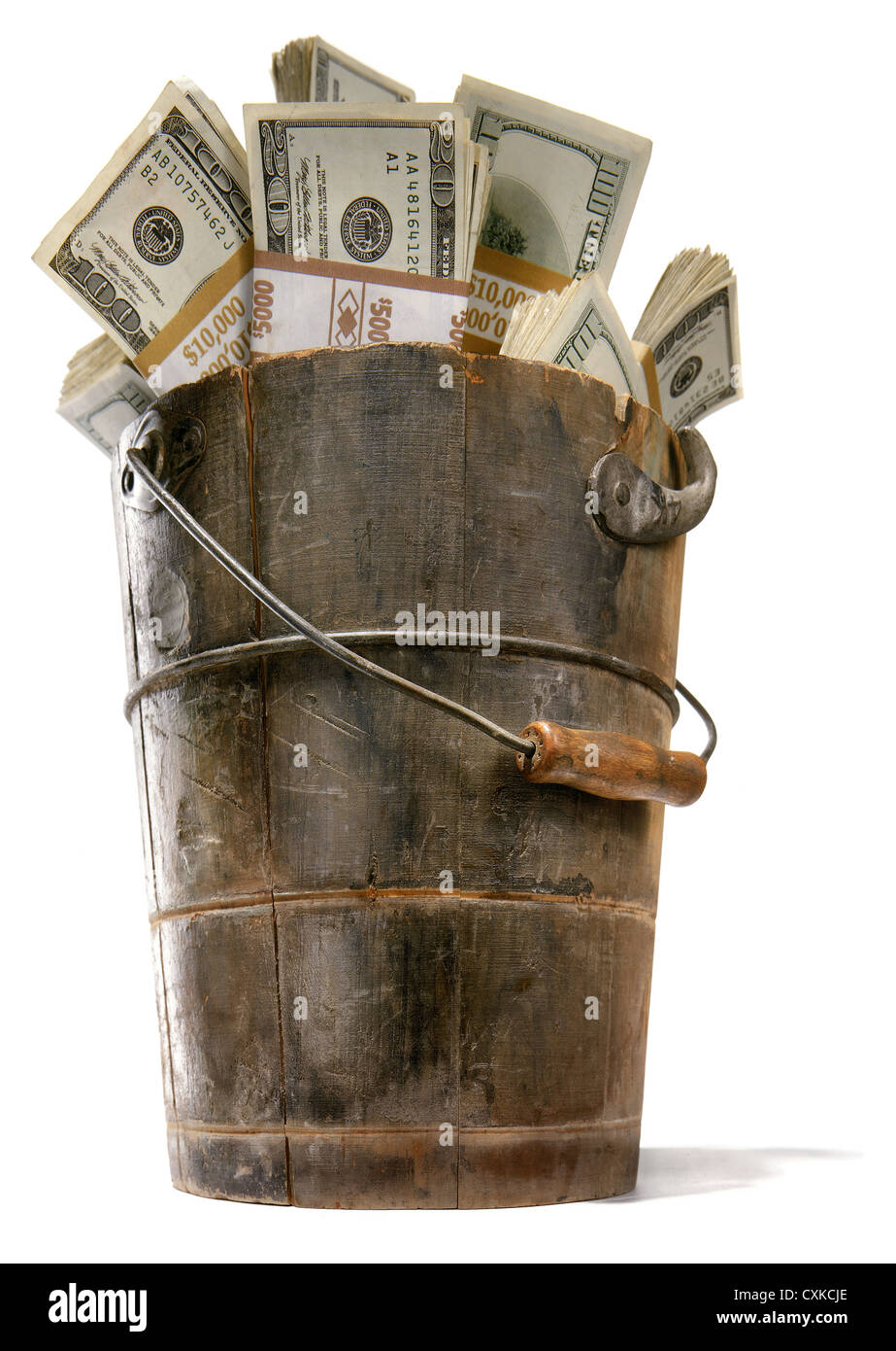 money in a bucket photographed on a white background Stock Photo