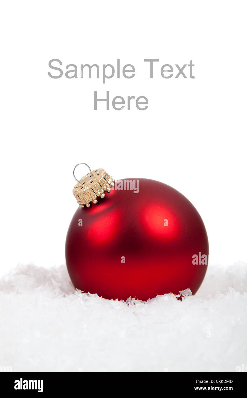Red shiny Christmas ornament on snow with copy space Stock Photo - Alamy