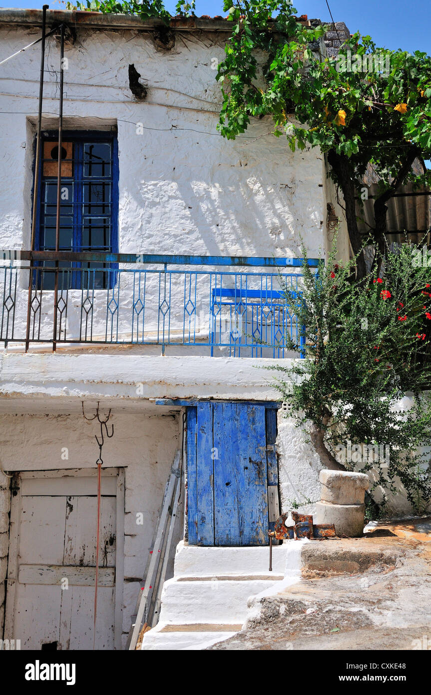 Whitewashed house with blue door in the hill village of Pano Elounda, above Elounda, Crete, Greece Stock Photo