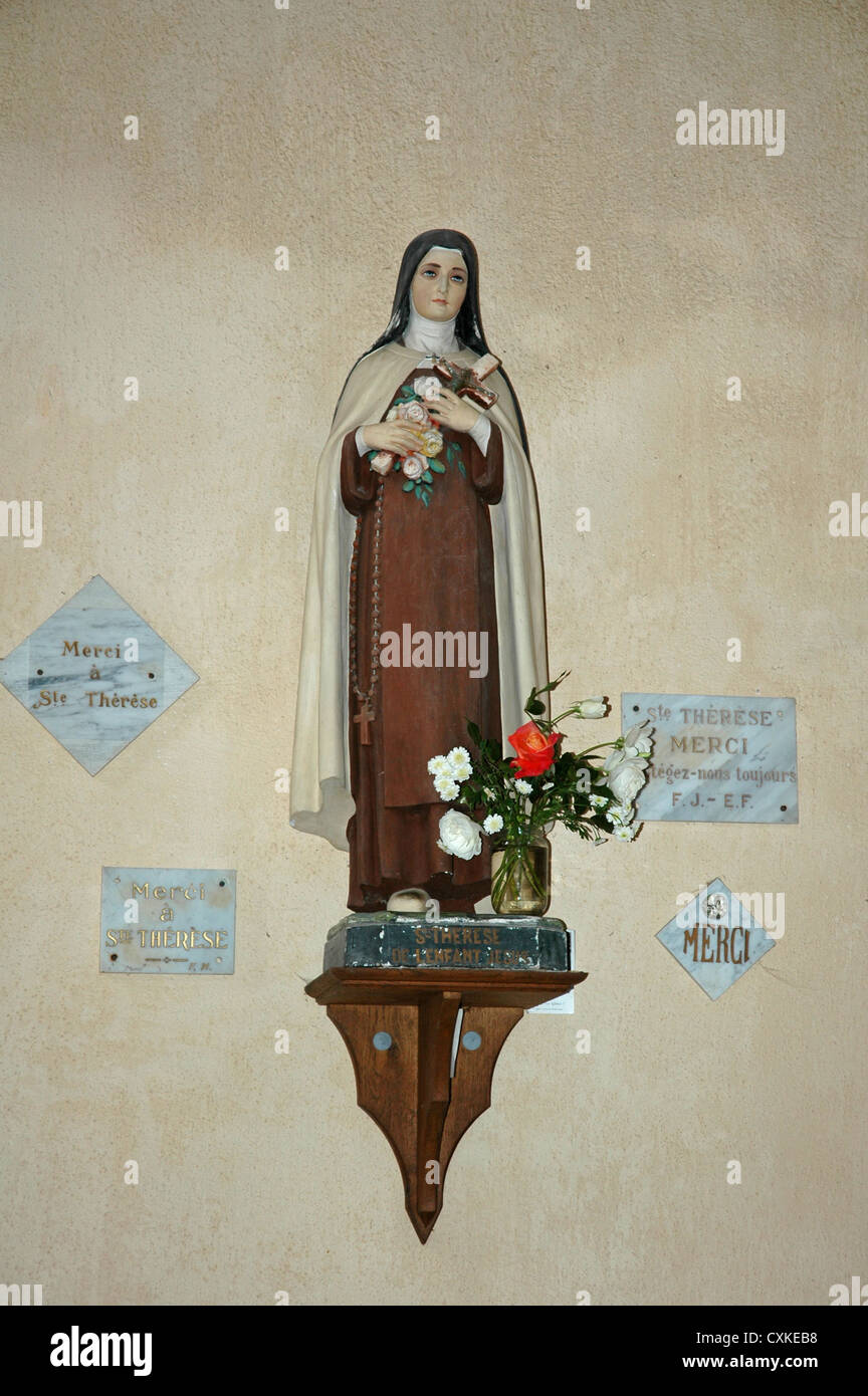 Statuette of Saint Therese in The church, Mortemart. Stock Photo