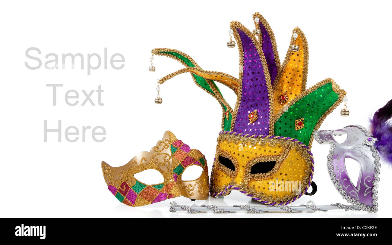 Mardi gras and jester masks on a white background with copy space Stock