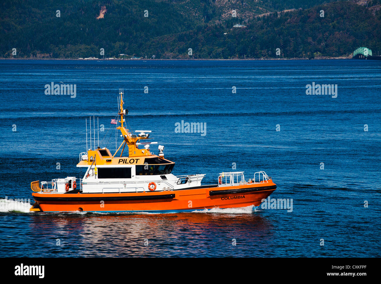 The Pilot Boat 'Columbia' heads up the Columbia River in Astoria, Oregon. Stock Photo