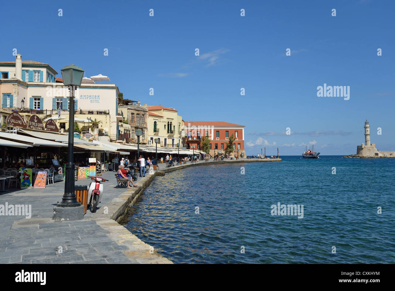 Restaurants on seafront promenade, Chania, Chania Prefecture, Crete, Greece Stock Photo