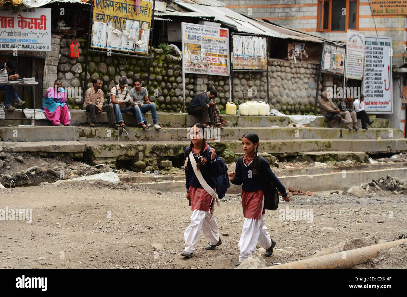 India, Himachal Pradesh, Manali, schoolchildren in uniform walking the street Stock Photo