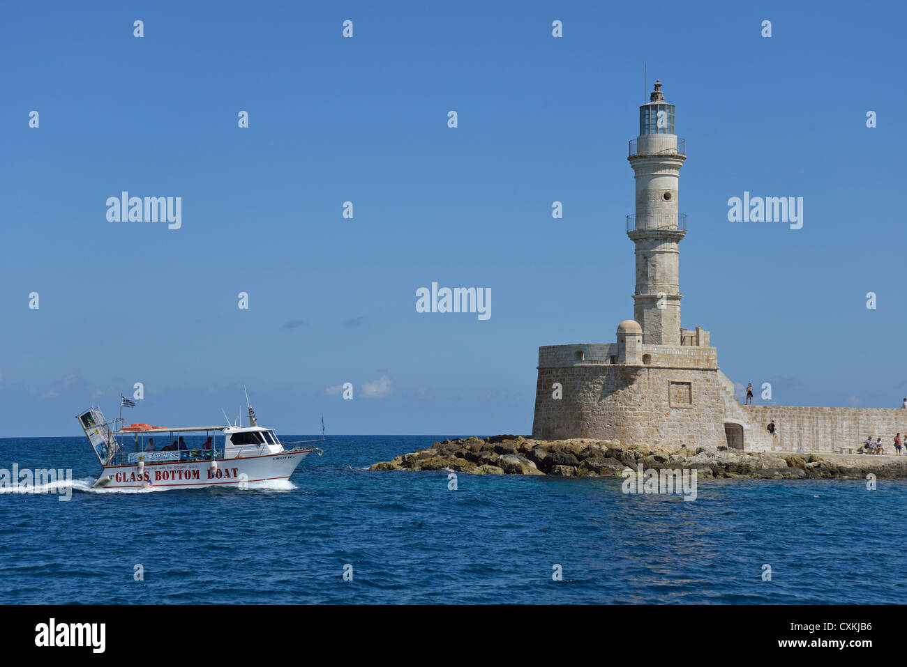 Old lighthouse at entrance to Venetian Harbour, Chania, Chania Prefecture, Crete, Greece Stock Photo