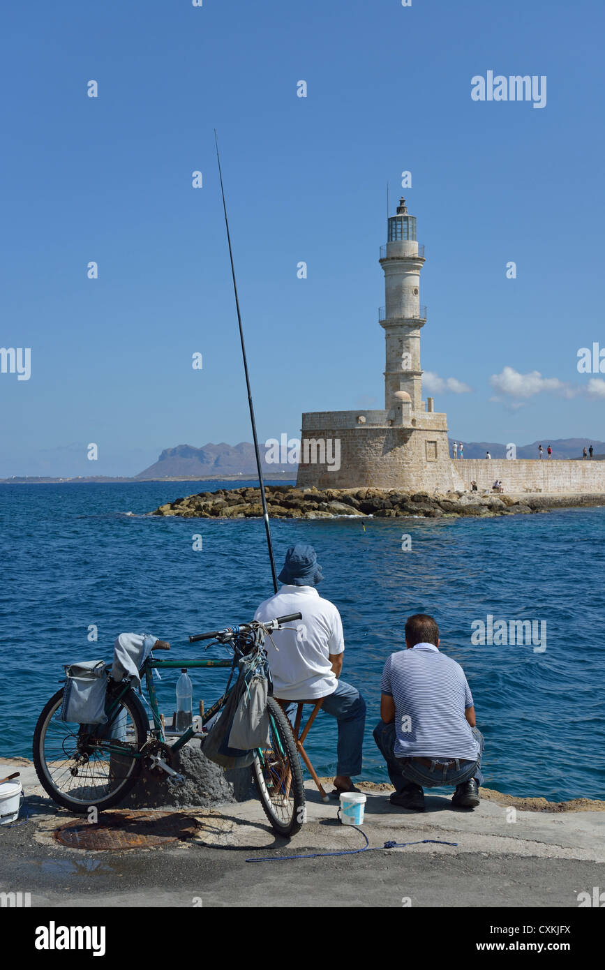 Old lighthouse at entrance to Venetian Harbour, Chania, Chania Prefecture, Crete, Greece Stock Photo