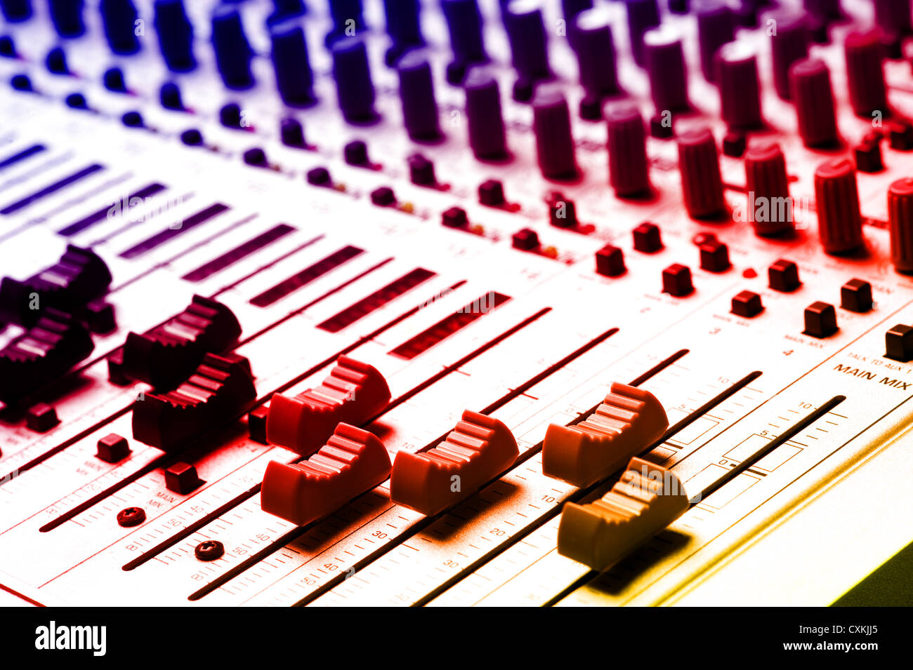 Audio recording equipment or soundboard background with many knobs and