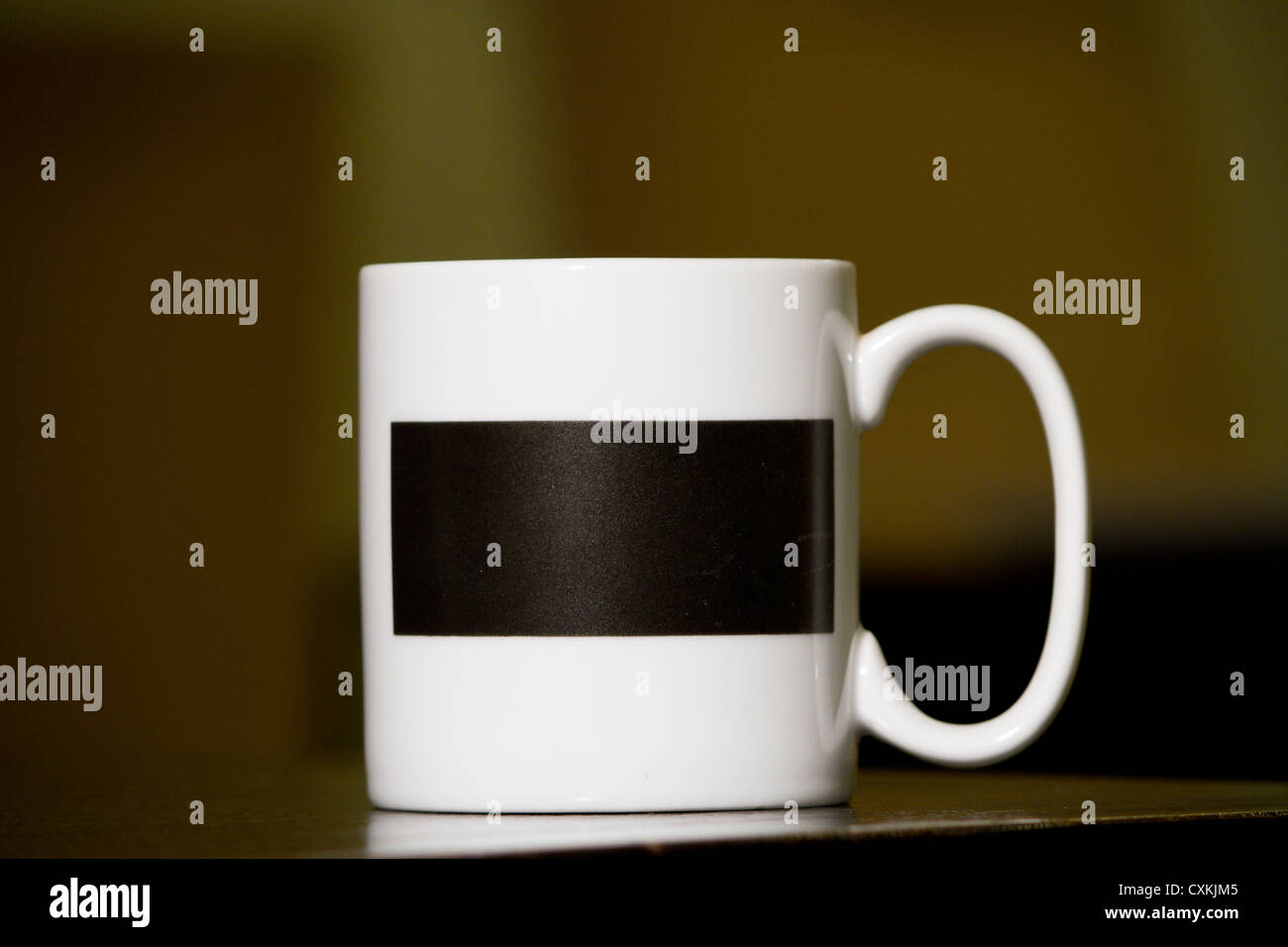 white cup coffee mug and belt swath black Stock Photo