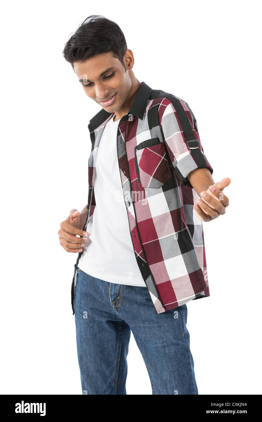 Portrait of a happy Indian man playing air guitar. Isolated against a white background. Stock Photo