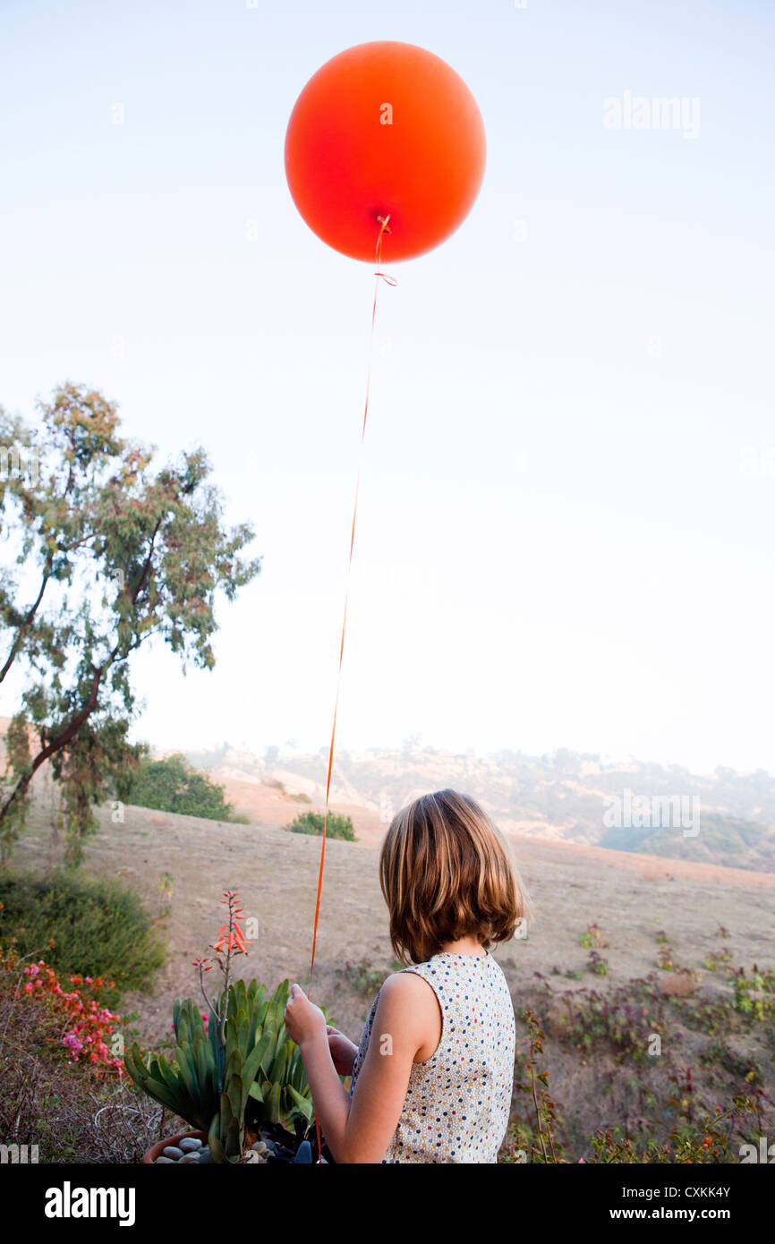 Girl with red balloon Stock Photo - Alamy