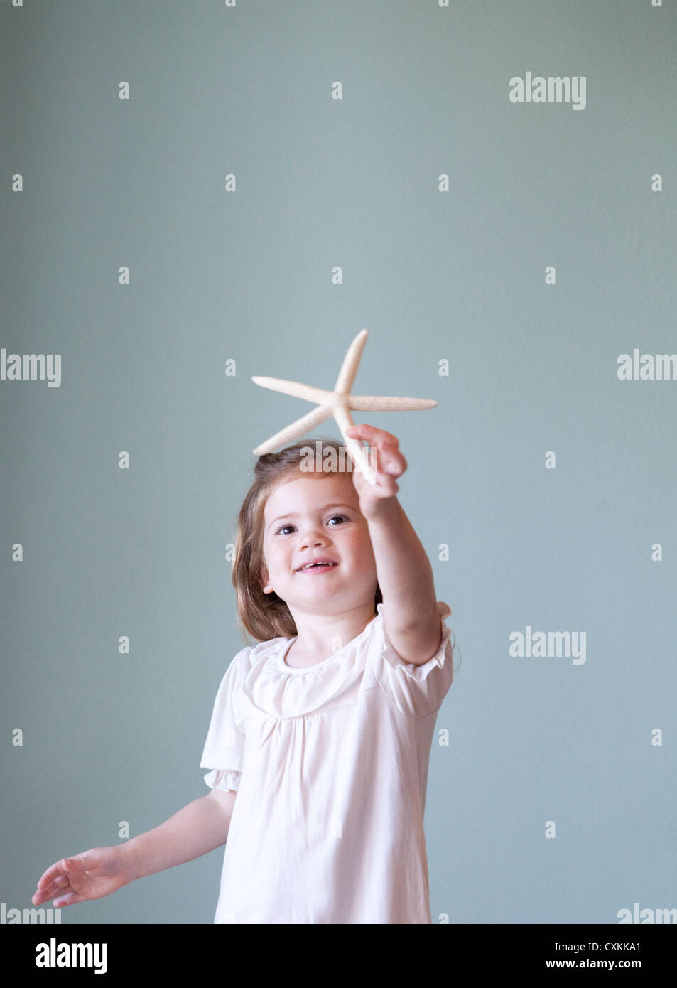 Young girl with starfish Stock Photo