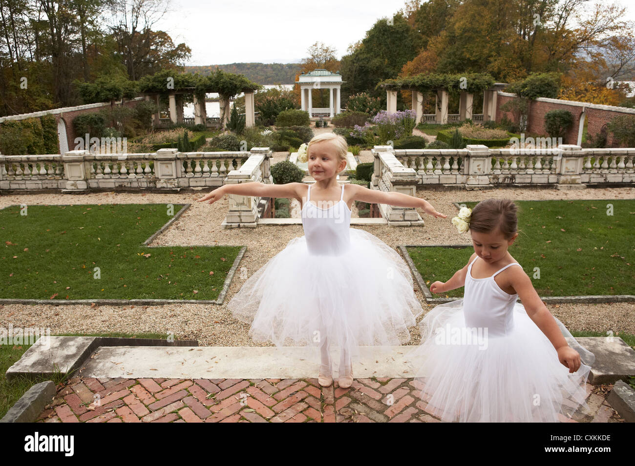 girls in tutu's dancing in a garden Stock Photo