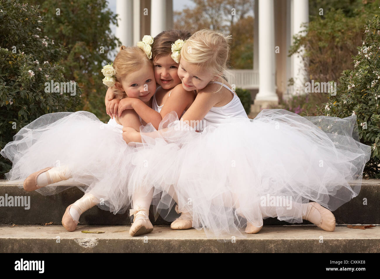 girls hugging in ballet costumes Stock Photo