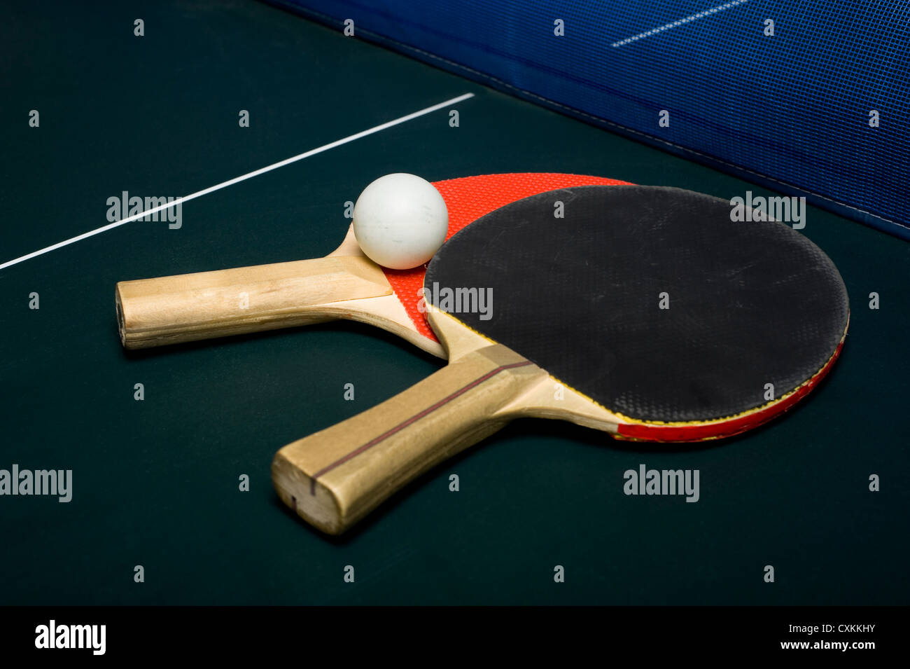 Ping-pong or table tennis equipment or supplies on a playing surface Stock Photo
