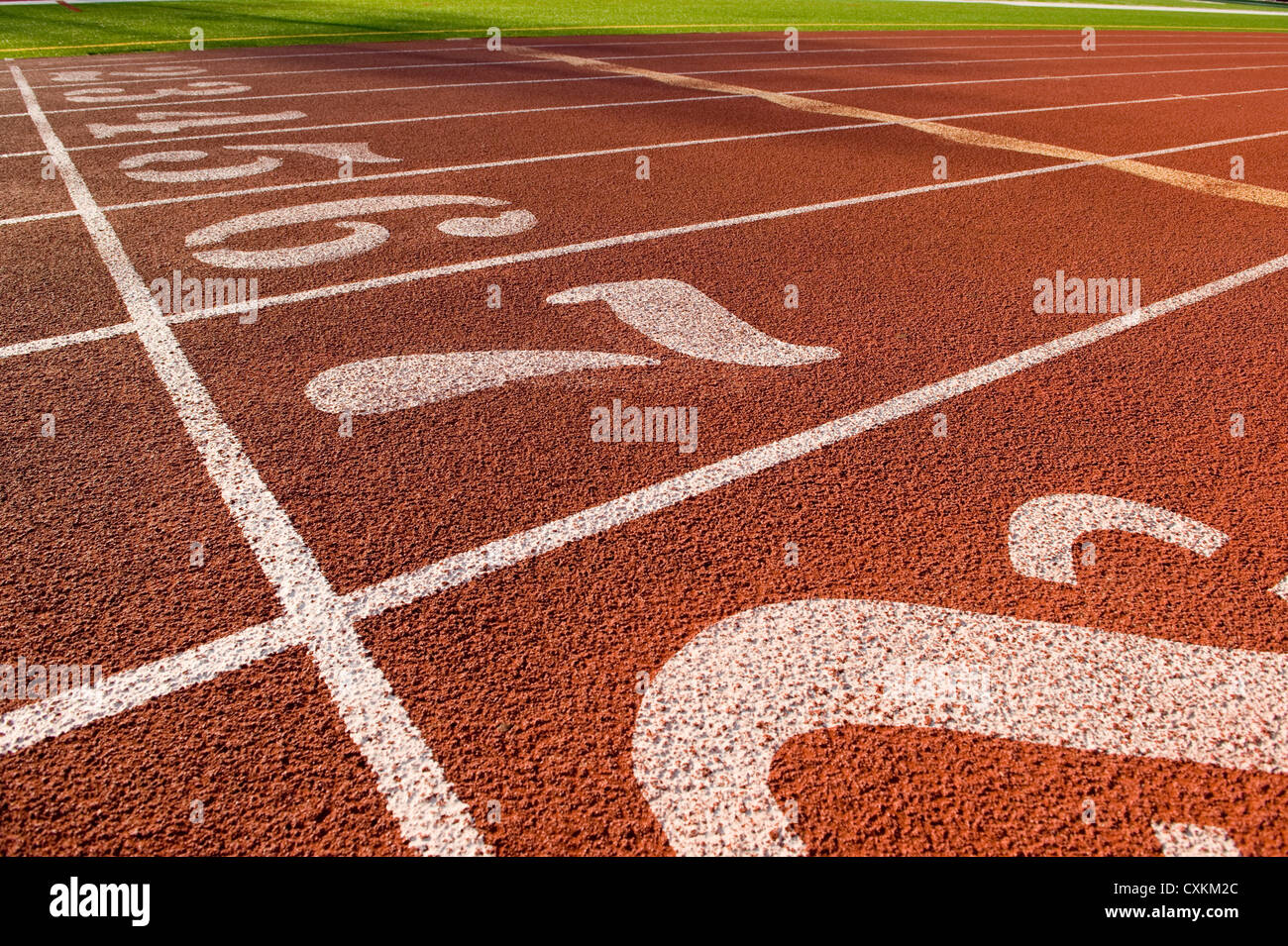 The running lane markers on a running track creating a track and field background Stock Photo