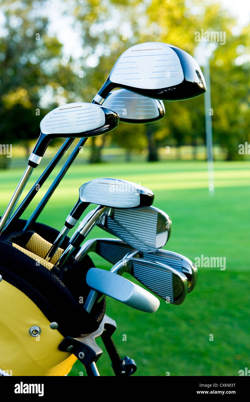 A set up new golf clubs on a beautiful golf course Stock Photo