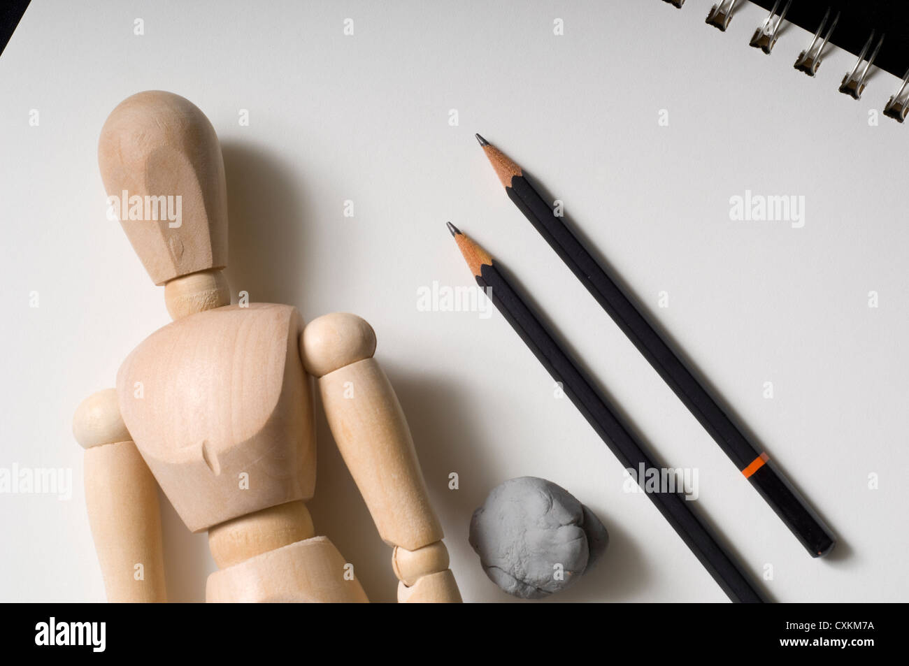 Drawing supplies including a wooden poser, pencils and an eraser Stock Photo