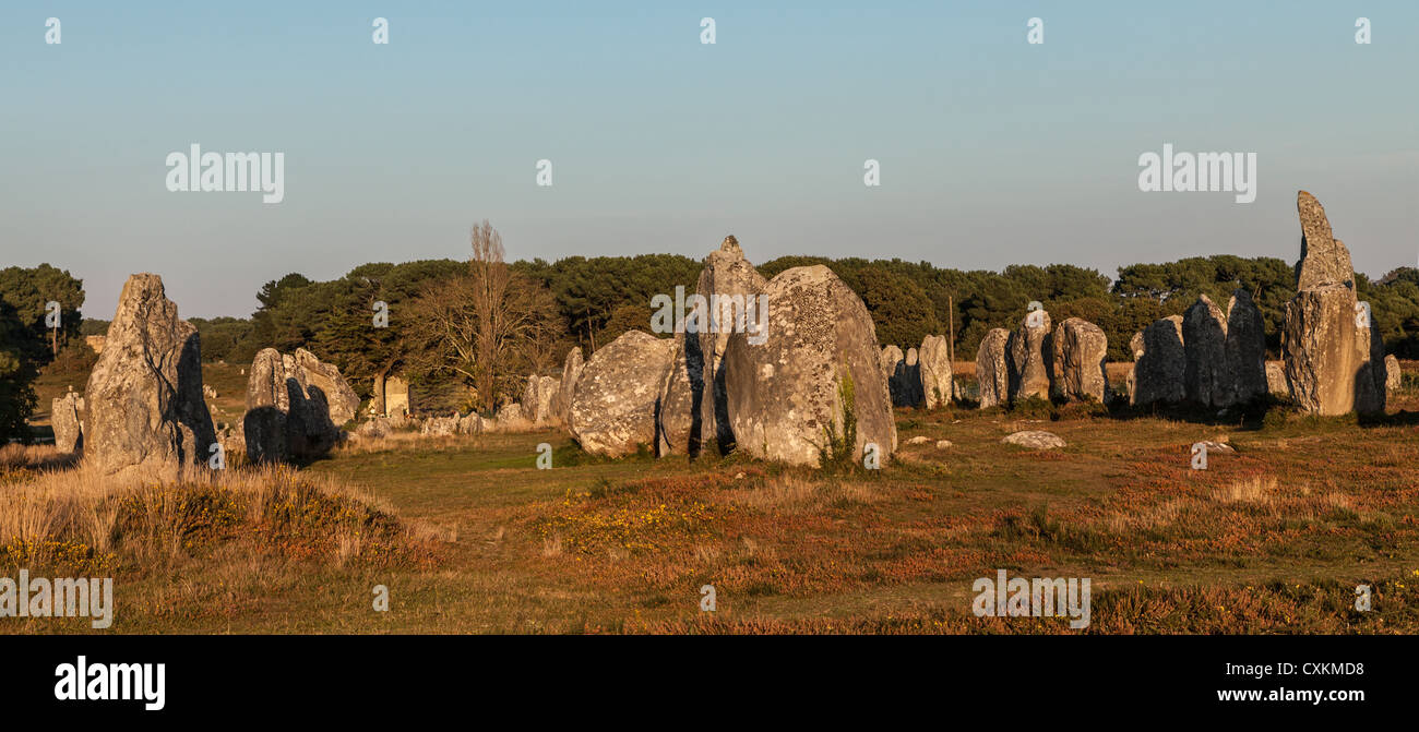 Image at the dusk of megalithic monuments menhirs in Carnac , Brittany in northwest of France. Stock Photo