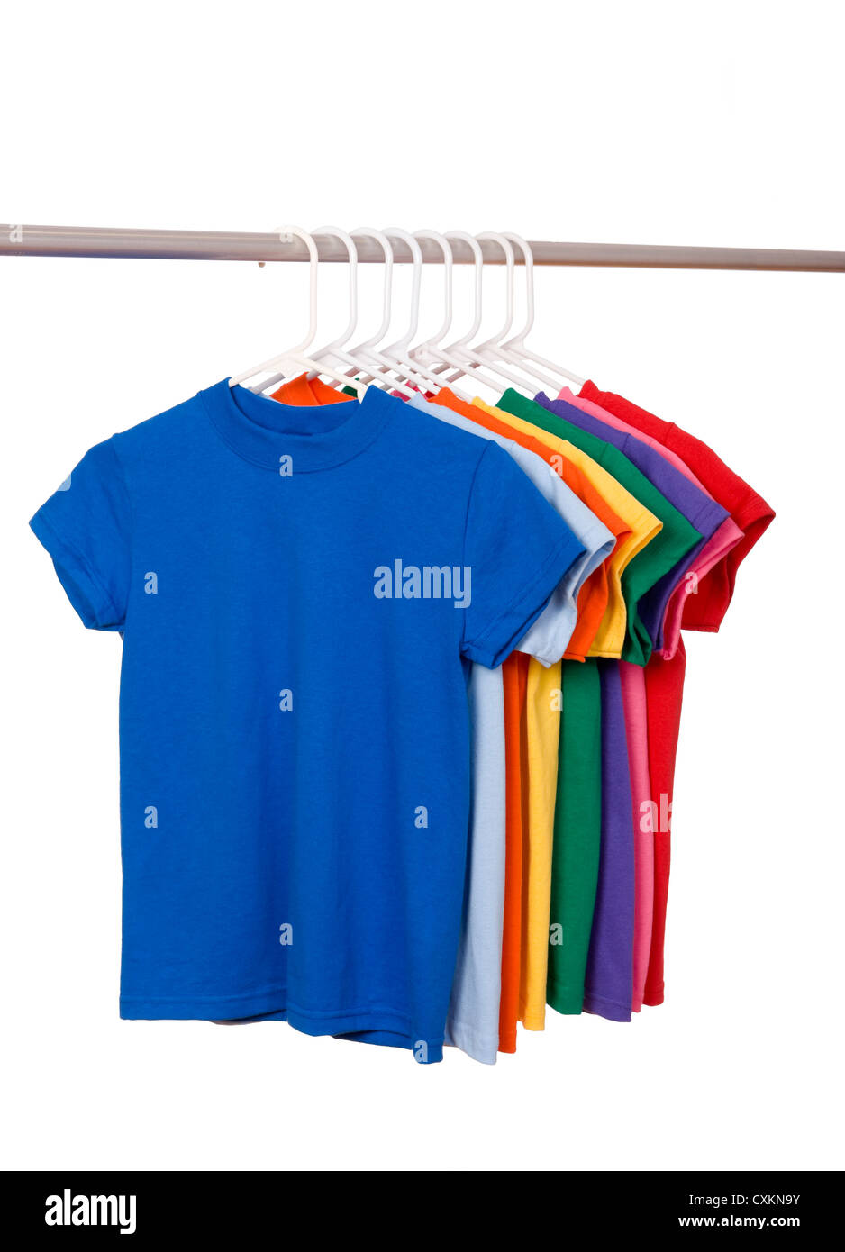 A row of colorful row t-shirts hanging on hangers on a white background Stock Photo