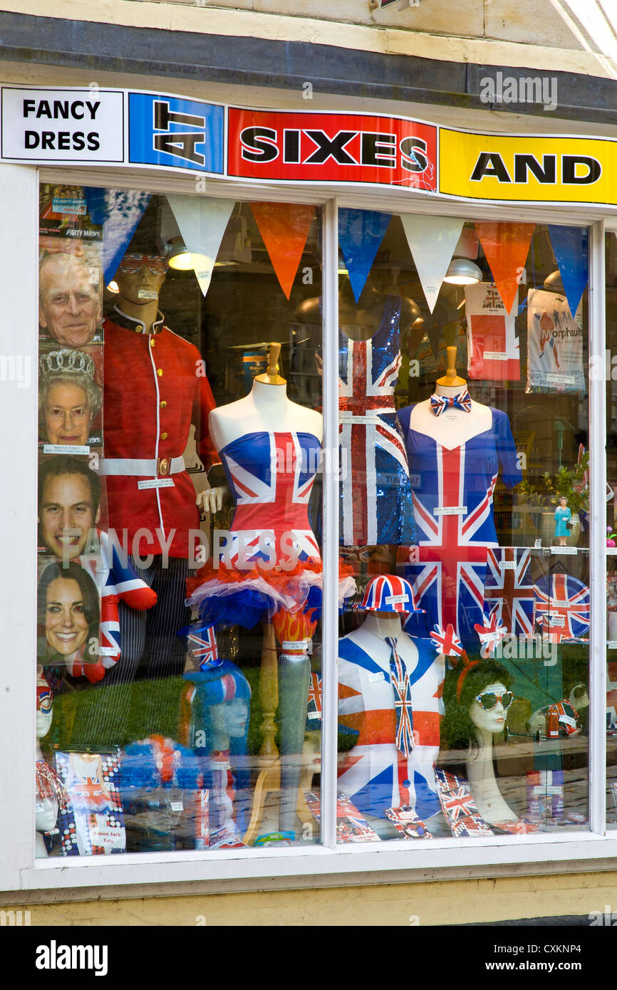 The windows of At Sixes And Sevens fancy dress shop in Abbey Green, Bath, UK  Stock Photo - Alamy