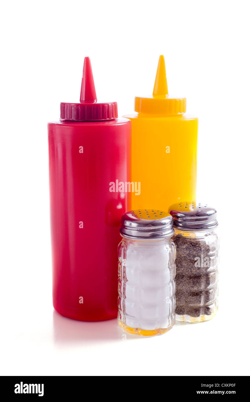 A café or restaurant tabletop setup with ketchup and mustard bottles and a salt and pepper shakers Stock Photo