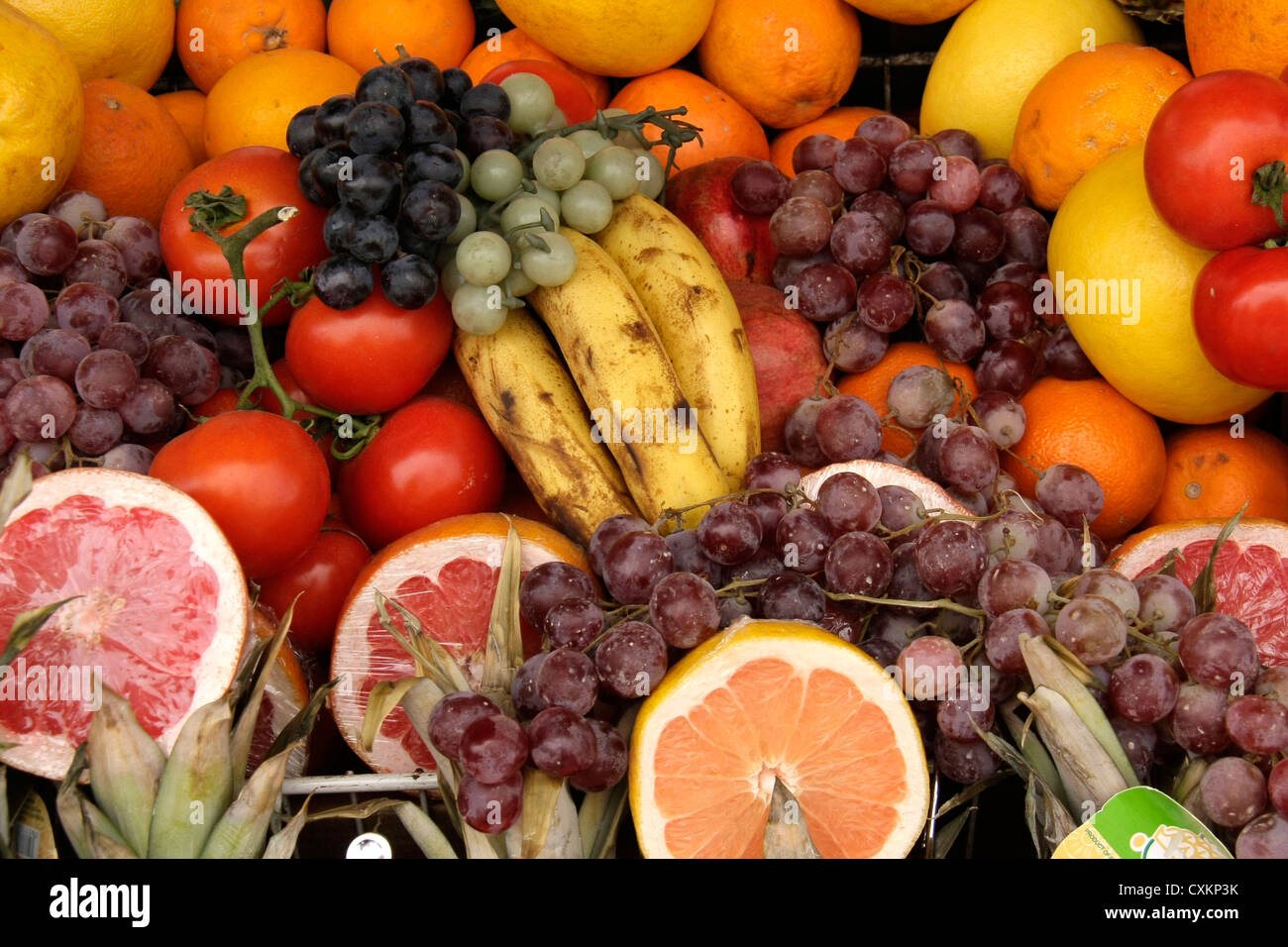 different types of fruits and vegetables displayed for sale in a basket Stock Photo