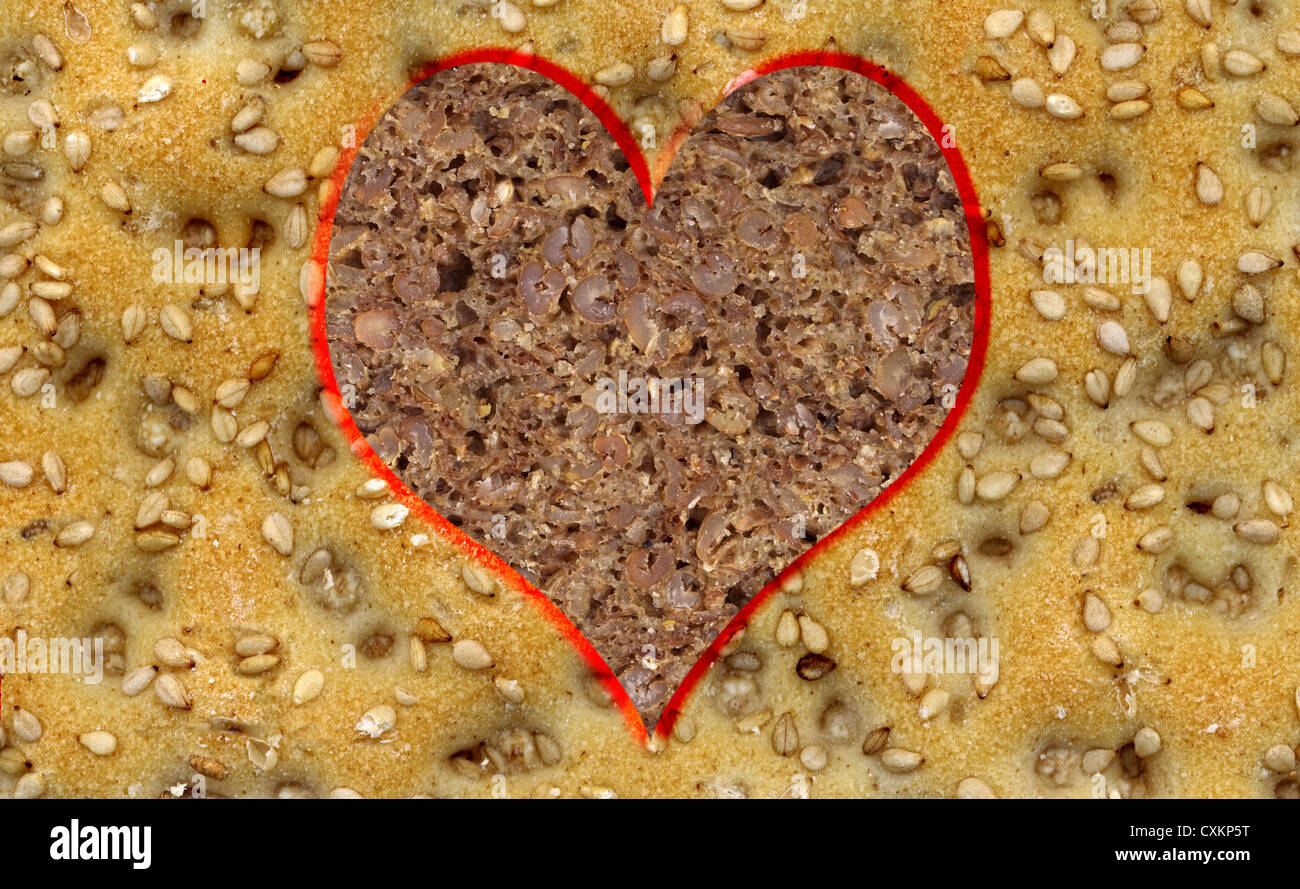 A slice of sesame crisp bread with a heart of wholemeal bread, Stock Photo