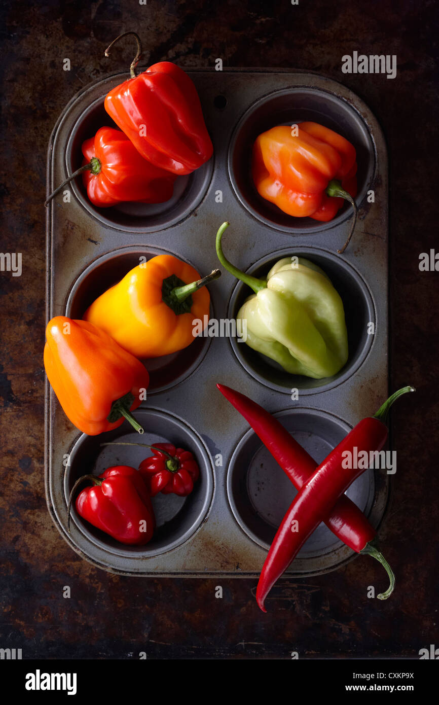 Variety of Peppers in Muffin Pan Stock Photo