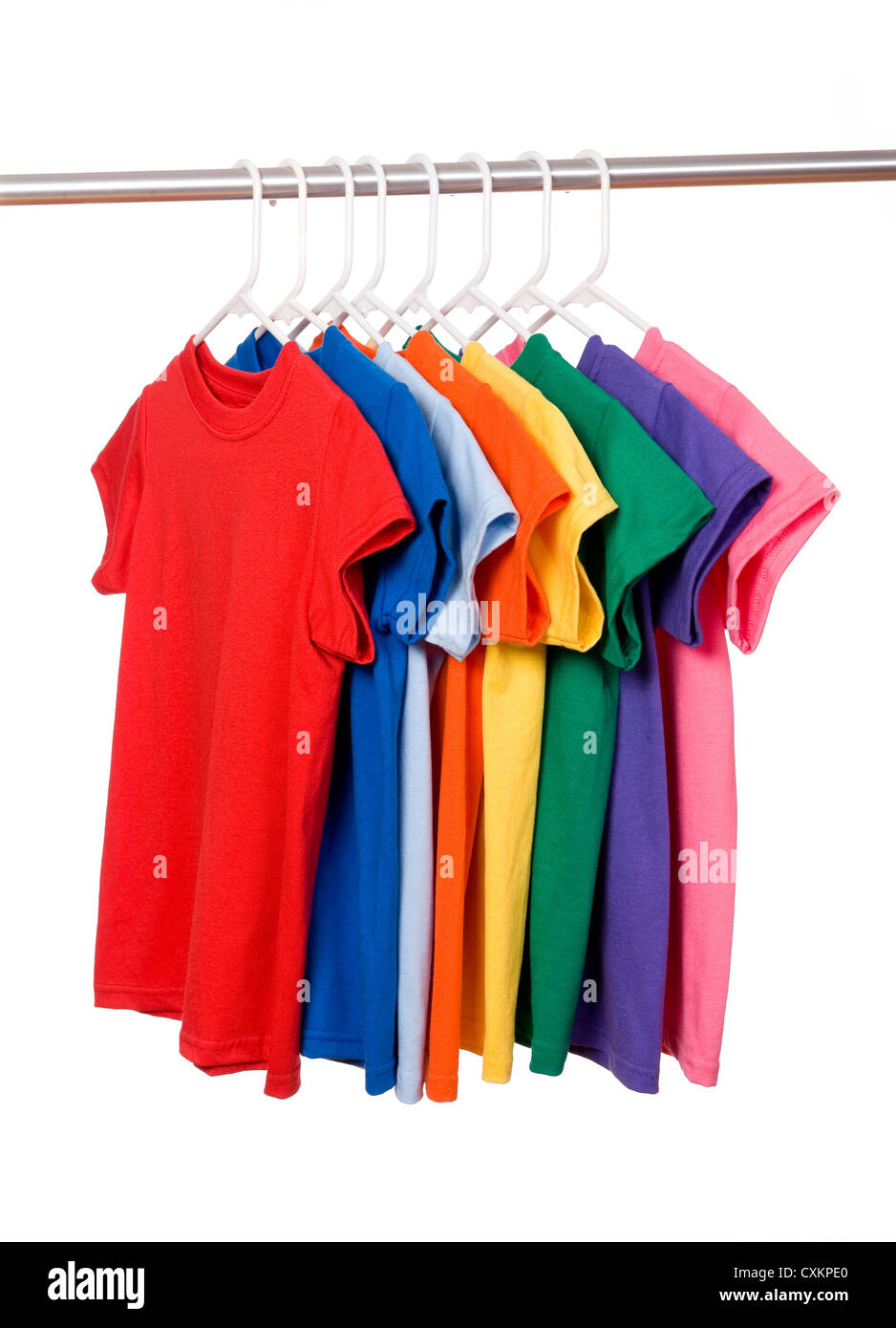 A row of colorful row t-shirts hanging on hangers on a white background Stock Photo