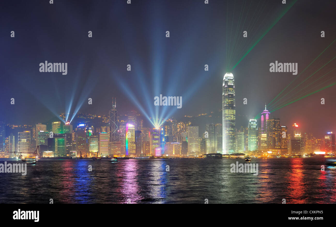 Hong Kong skyline at night with lights and skyscrapers over sea with ...