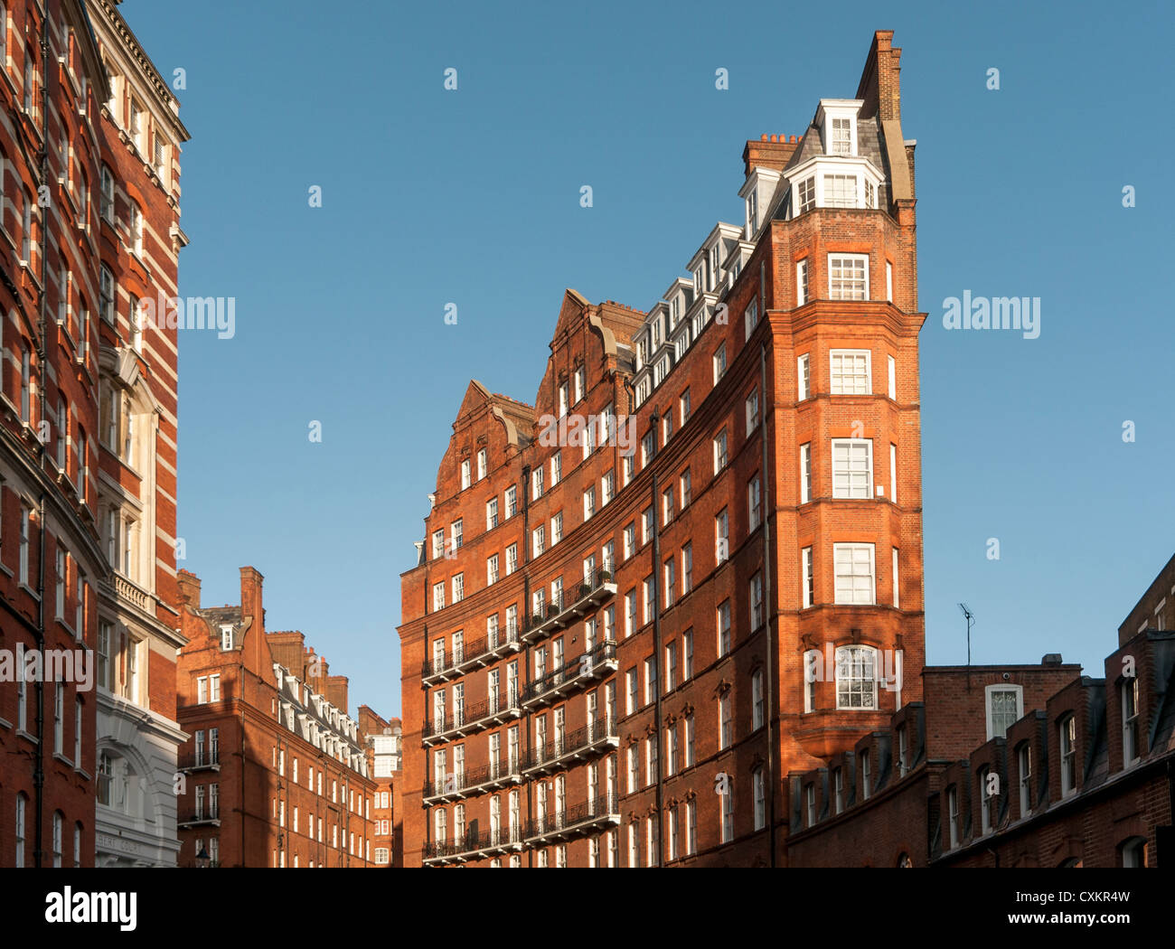 Curved Facade of Red-brick Victorian Kensington Gore Mansions, Knightsbridge, London, England, UK Stock Photo