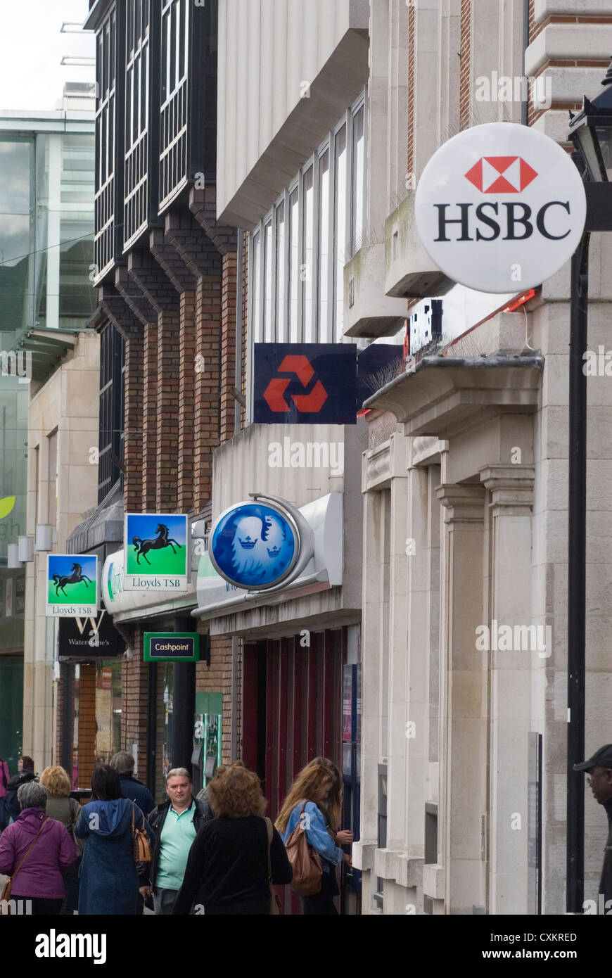 High Street Banks signs home counties UK 2007.  2000s people shopping in the high street, woman using a cash point when there were still banks in a local High Street. HSBC, Nat West, National Westminster Bank,  Barclays,  Lloyds, TSB, and a  Cashpoint HOMER SYKES Stock Photo