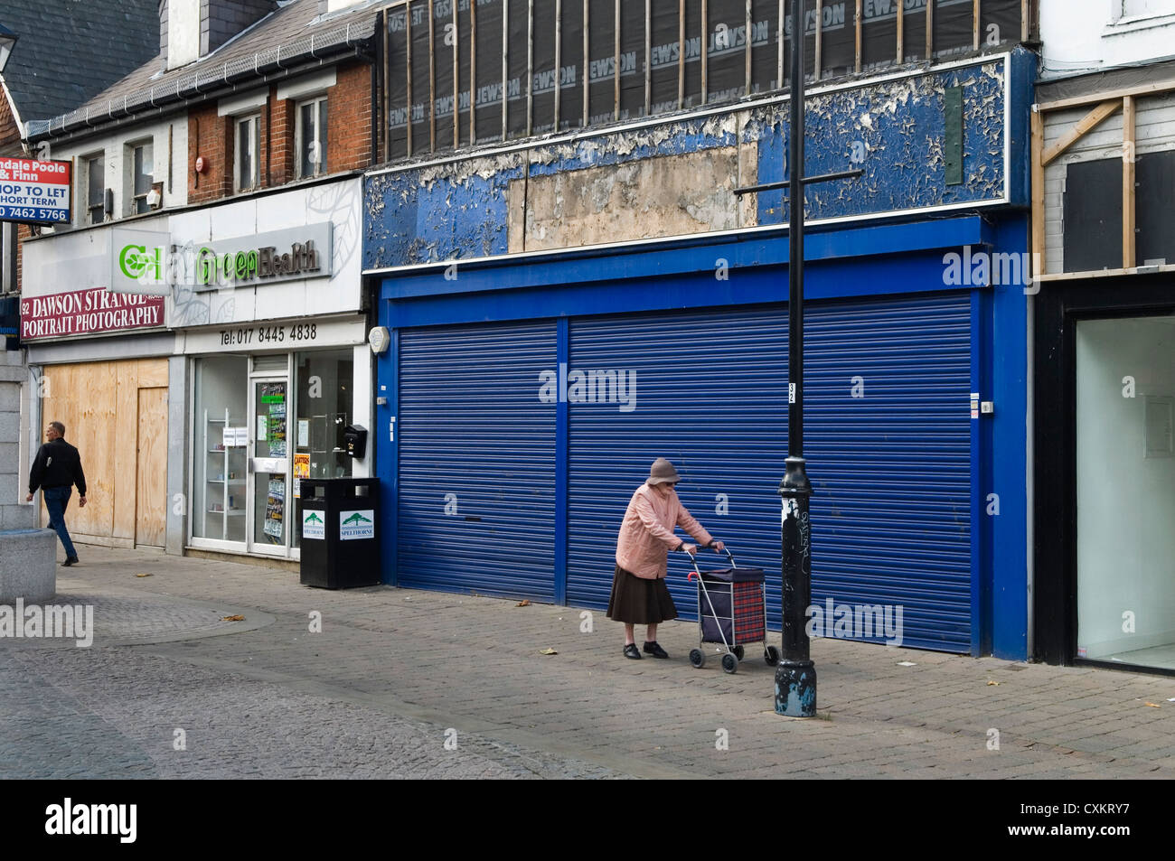 High street shops have gone out of business, a recession closed down. Four shops in a row in Staines. Middlesex. UK  2010s 2012 HOMER SYKES Stock Photo