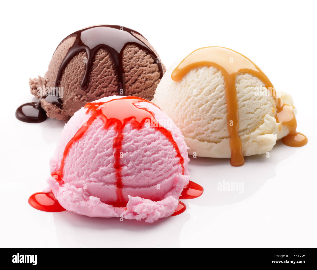 three scoops of ice cream with syrup Stock Photo