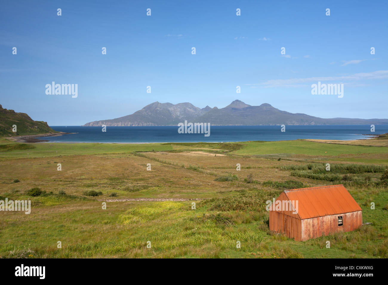 Tin shed above the Bay of Laig on Eigg looking over the sea to Rum Scotland UK Stock Photo