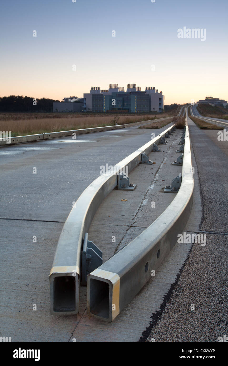 Cambridge guided busway track road and crash barriers leading towards Addenbrookes Hospital Stock Photo