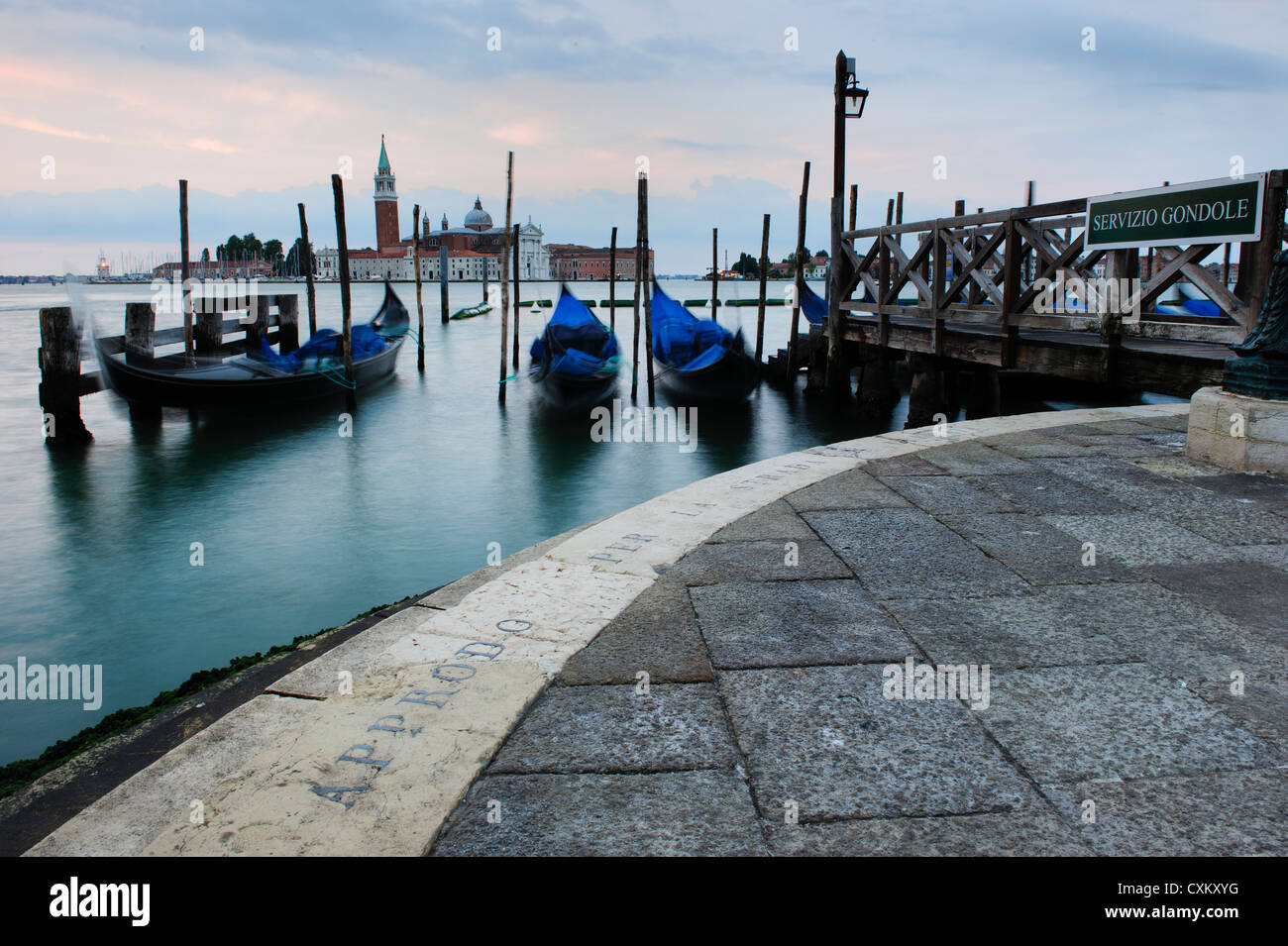 Gondolas Moored by the St. Mark's Basin, Venice, Italy. Stock Photo