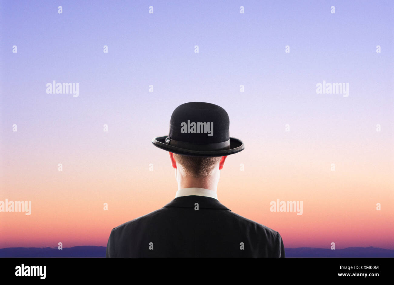 man facing twilight sky Stock Photo