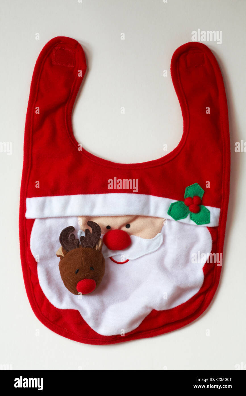 Baby's Christmas bib with Santa Claus Father Christmas and Rudolph the Red Nosed Reindeer isolated on white background Stock Photo
