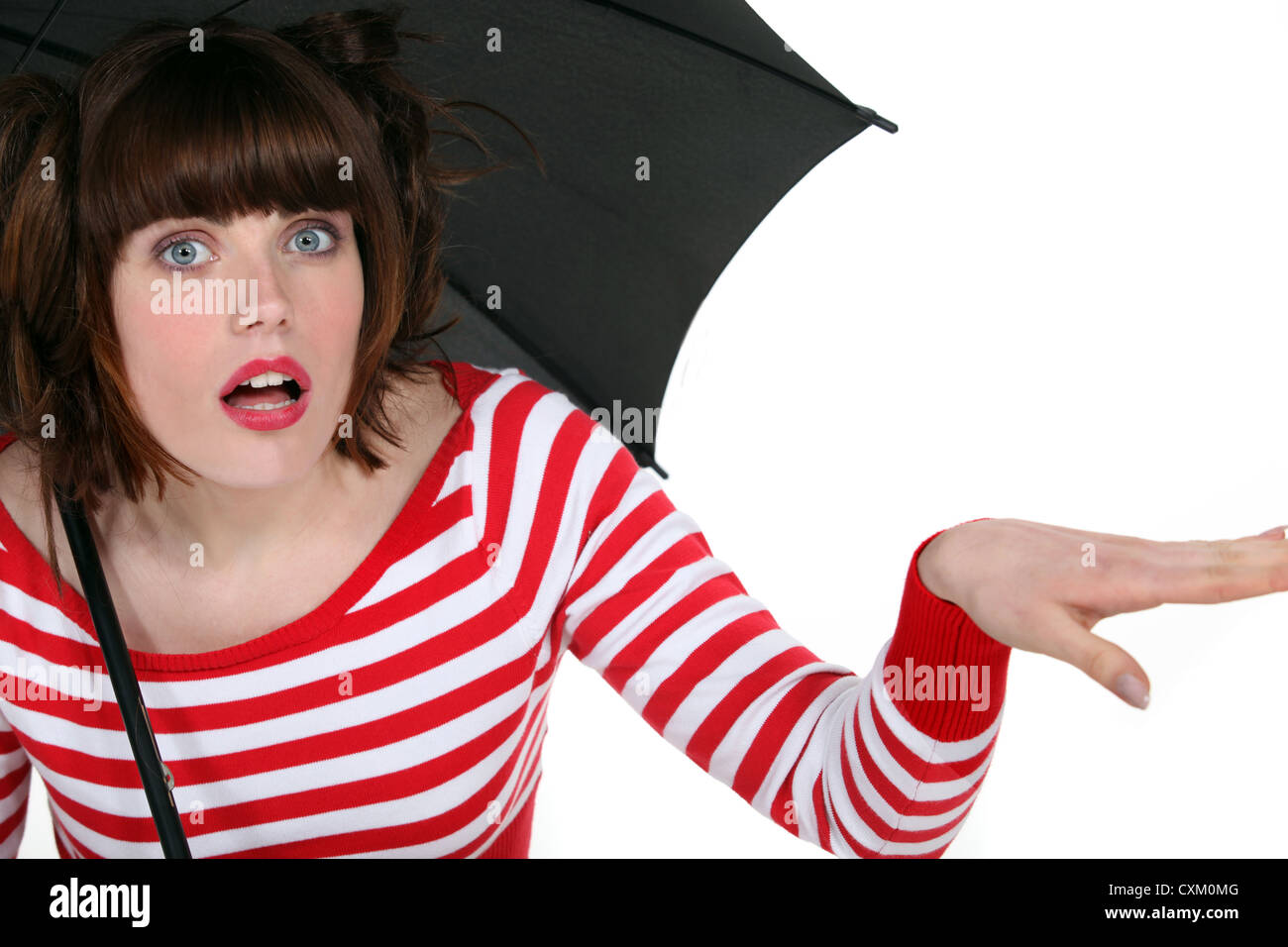 Shocked woman under an umbrella Stock Photo Alamy