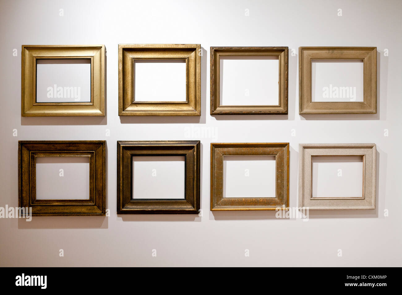 empty picture frames arranged on a white wall Stock Photo